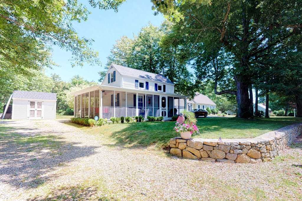 Welcoming home on Main St with screened porch & large yard, 1 dog OK