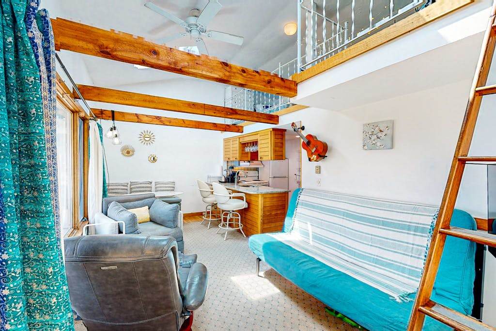 Seaside condo with patio, beach access, loft, board games, gas grill, & firepit