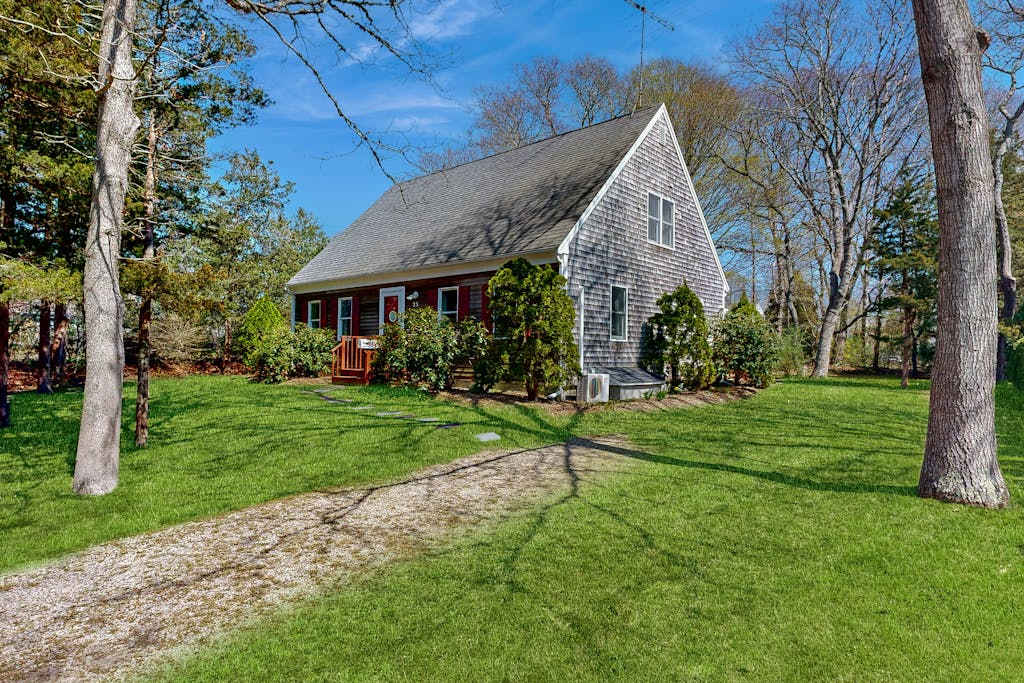 2-story home near the beach with large lawn, deck, washer & dryer, streaming, & partial AC