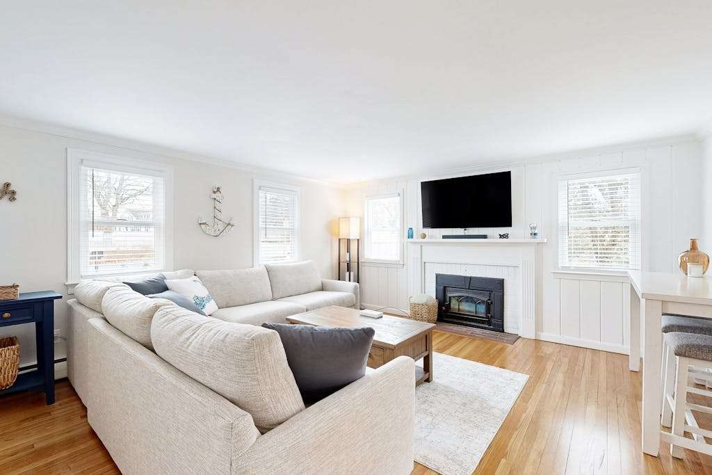 Two-story dog-friendly retreat with enclosed yard, playset, washer & dryer, & firepit