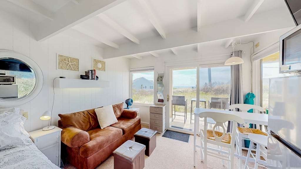 Ocean-view studio near golf with patio, beach gear, kitchenette, & partial AC