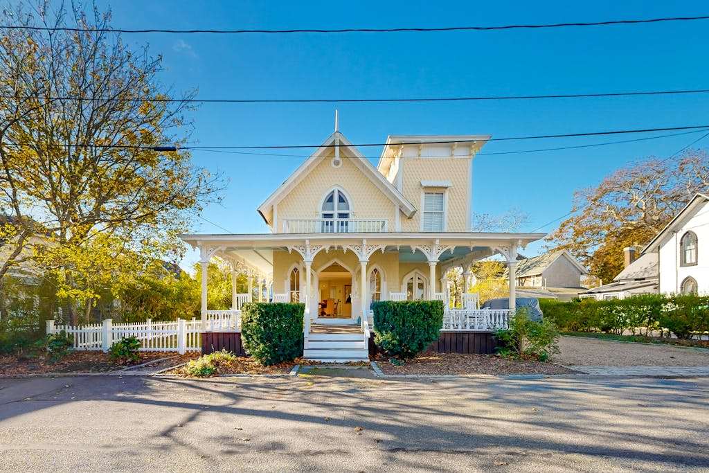 Historical house with wraparound porch, modern updates, enclosed yard, & washer & dryer