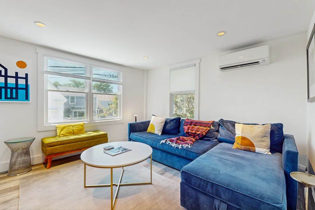 Second-floor condo steps from downtown with large deck, partial bay view & AC
