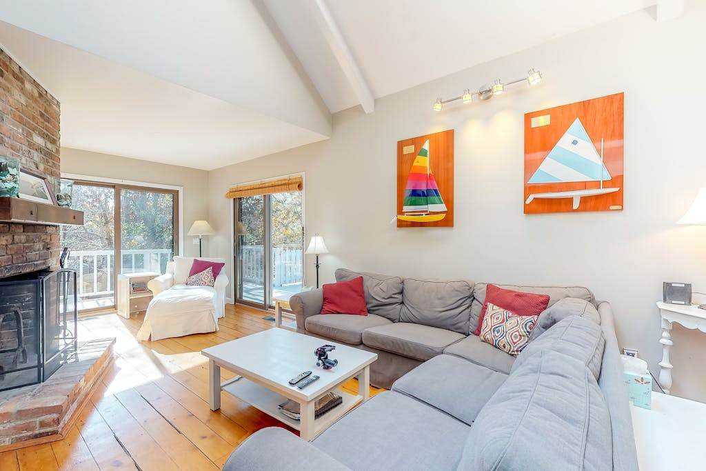 Family-friendly home in the trees with wraparound deck - near beaches
