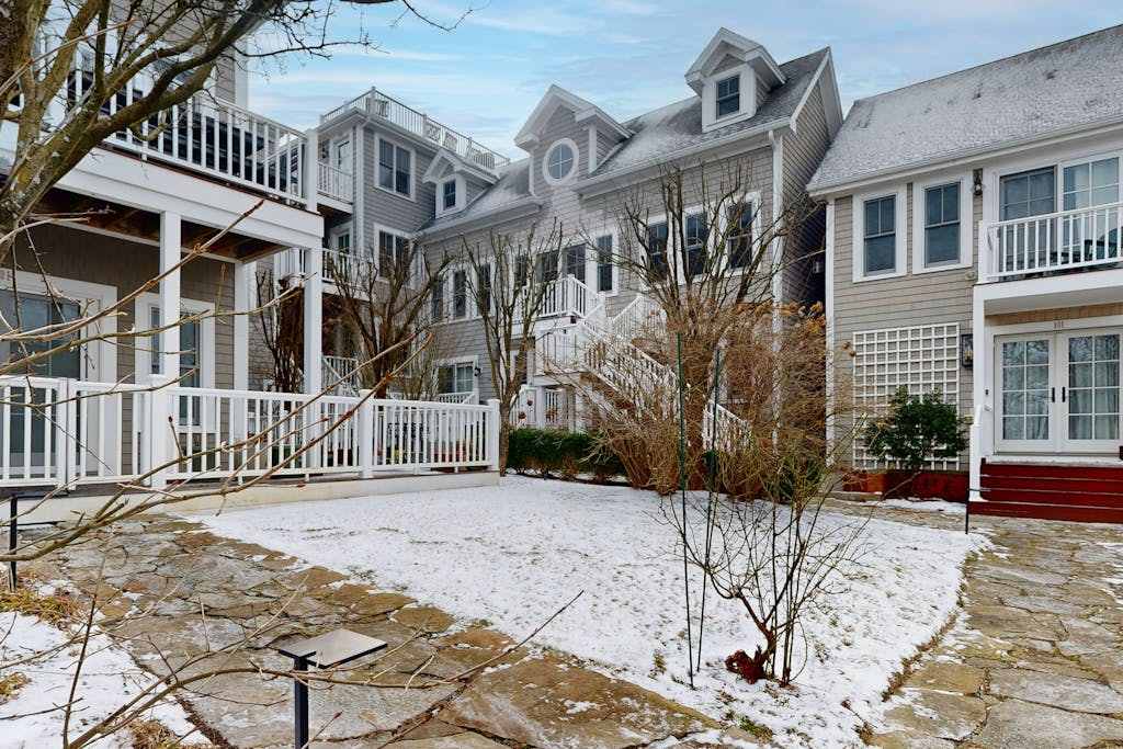 Modern west end condo close to beach with deck, washer & dryer, parking, & AC
