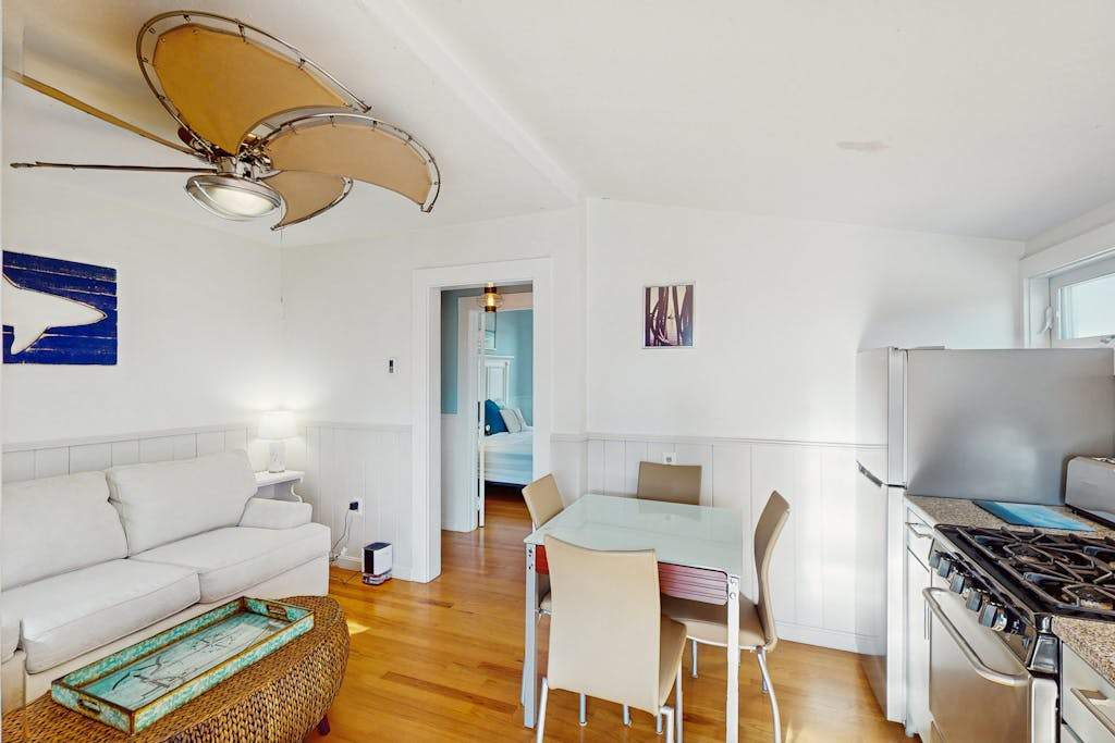 Cozy coastal condo steps from the beach with private deck & two parking spots