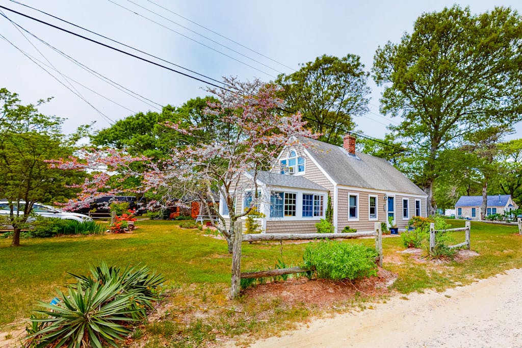 Two-story home with beach access, sunroom, fast WiFi, washer & dryer, & partial AC