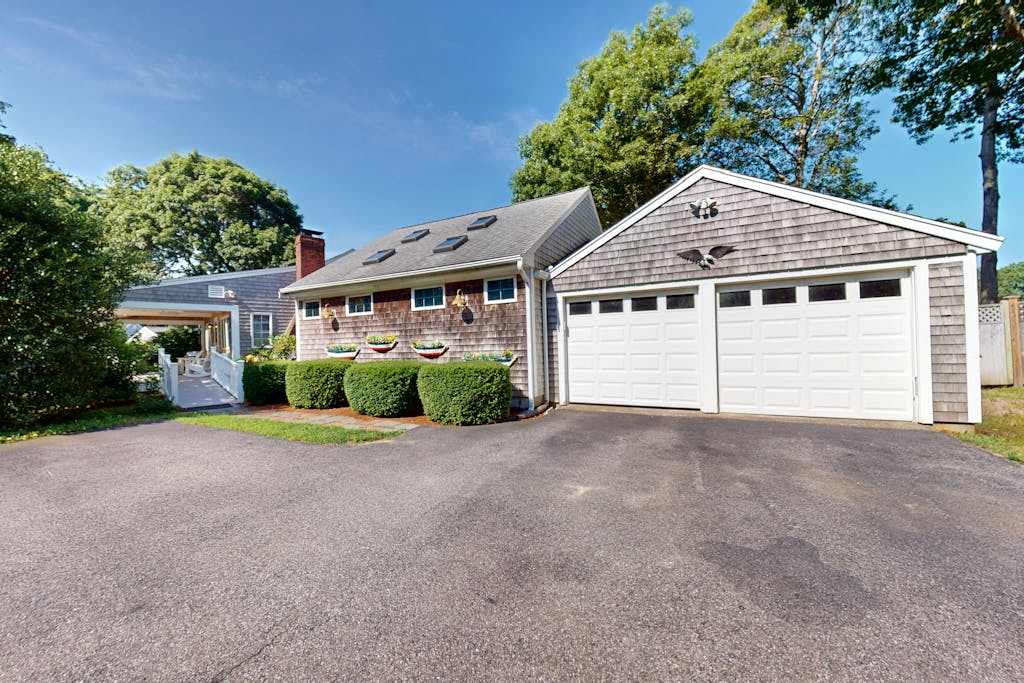 Tree-lined home with lovely yard, decks & private beach access - walk to town