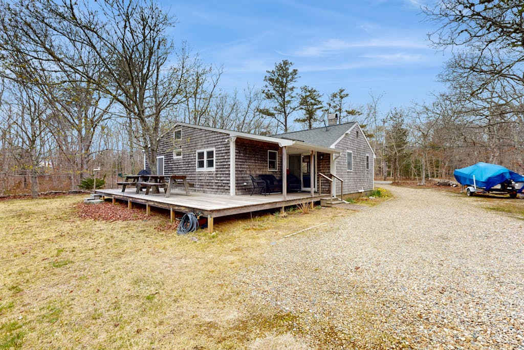 Quaint home across from bike paths with large furnished deck, grill, & washer & dryer