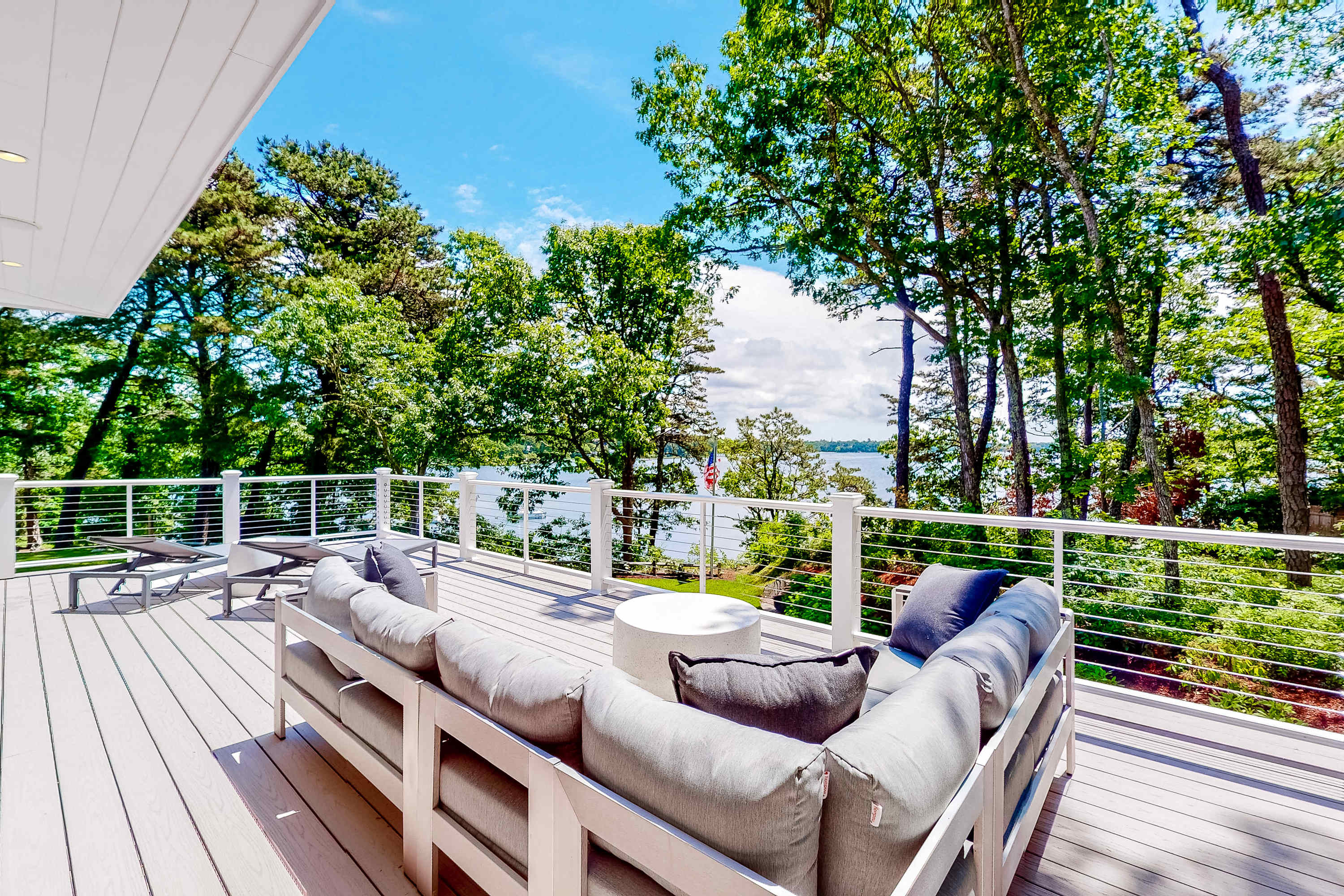 Luxe lakefront home on Follins Pond with private beach, amazing decks & yard