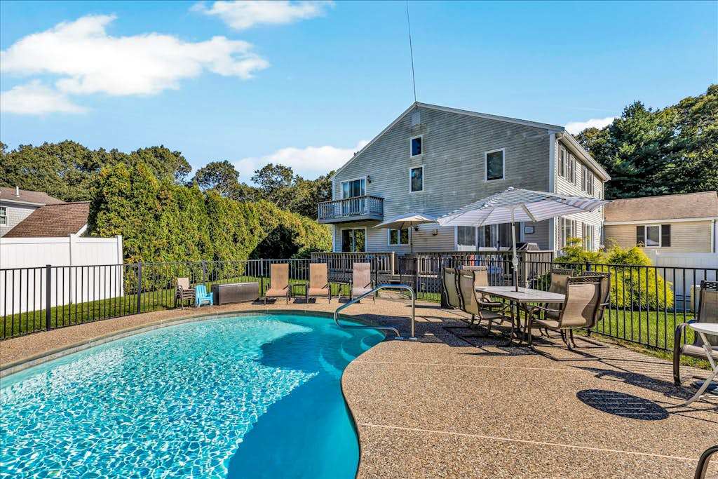 Spacious coastal retreat with heated pool, kayaks, game room & pond views
