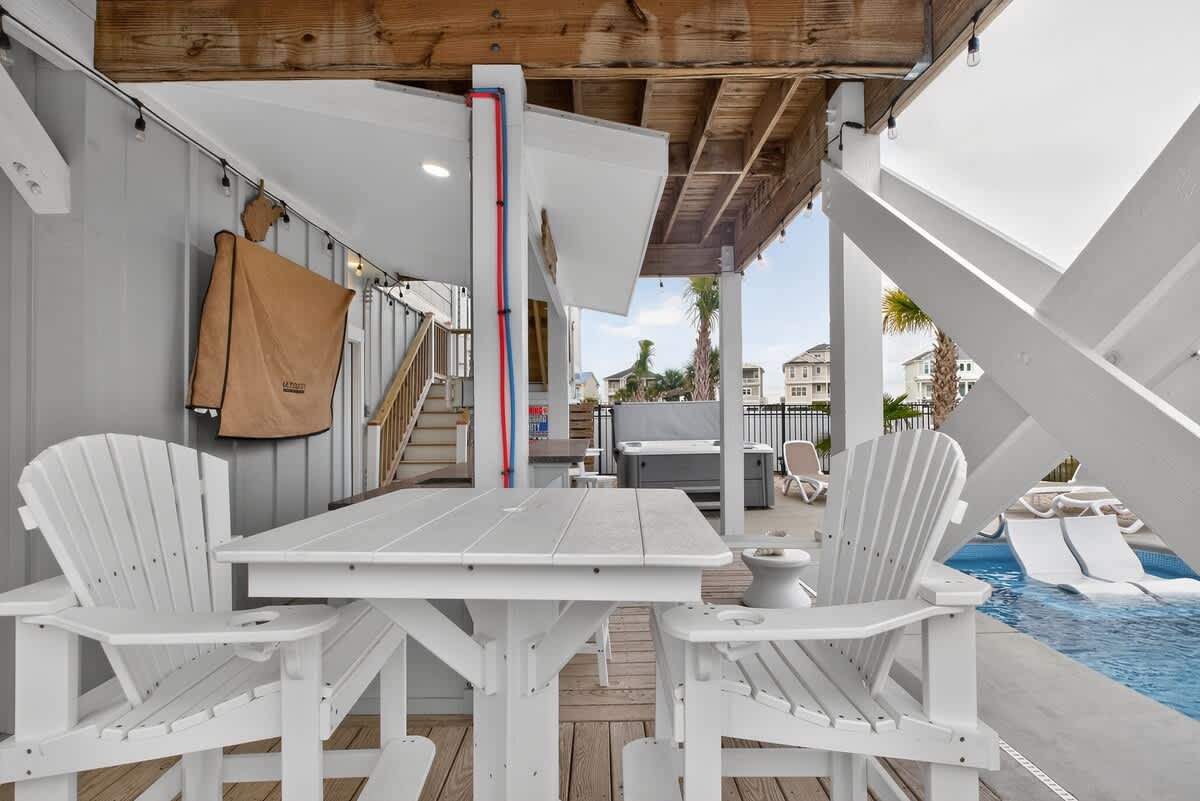 Pool, hot tub, bar, and games—your outdoor stay‑all‑day zone.