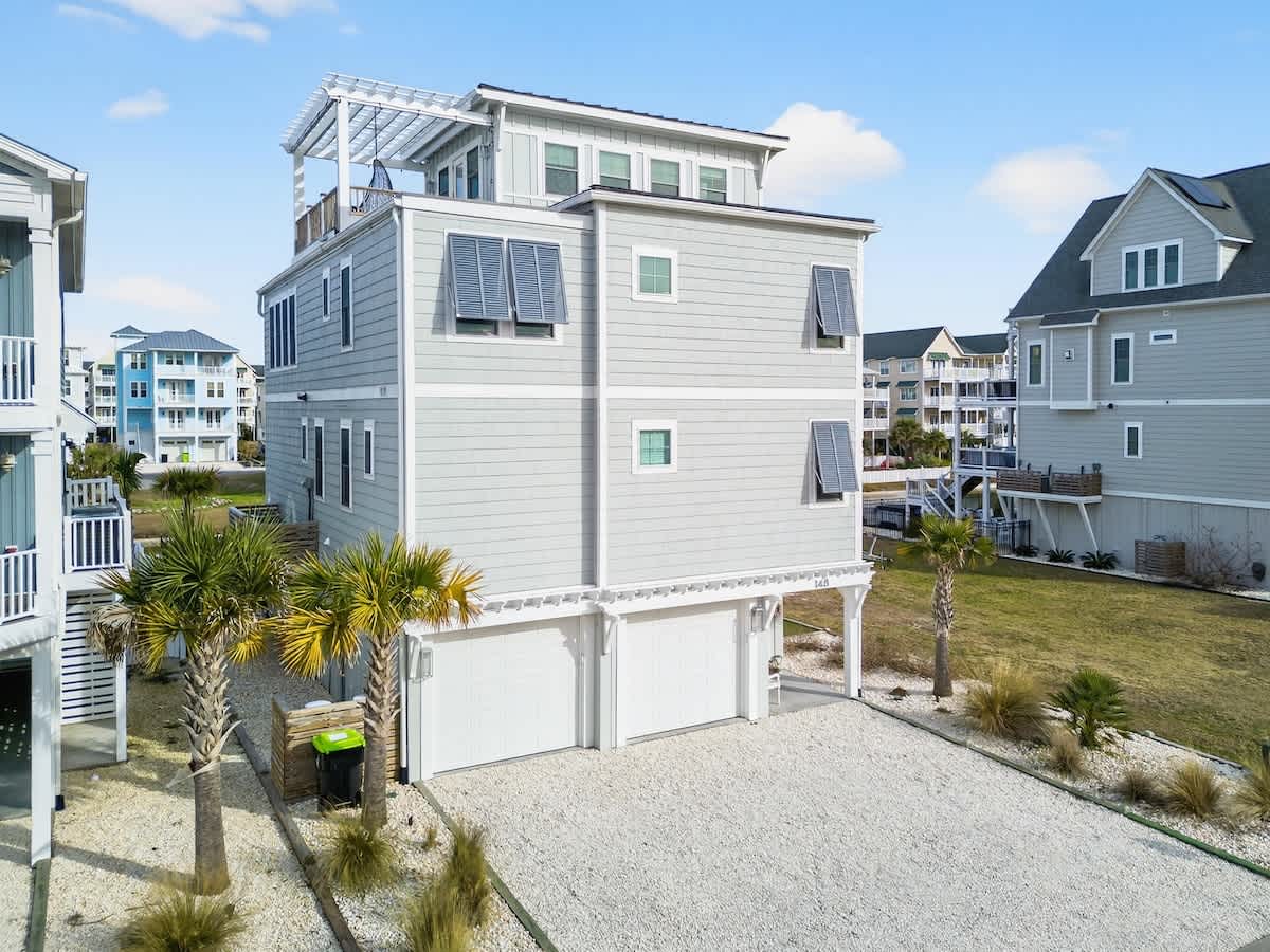 Modern coastal exterior welcomes you to Endless Summer by Brunswick Vacation Rentals.