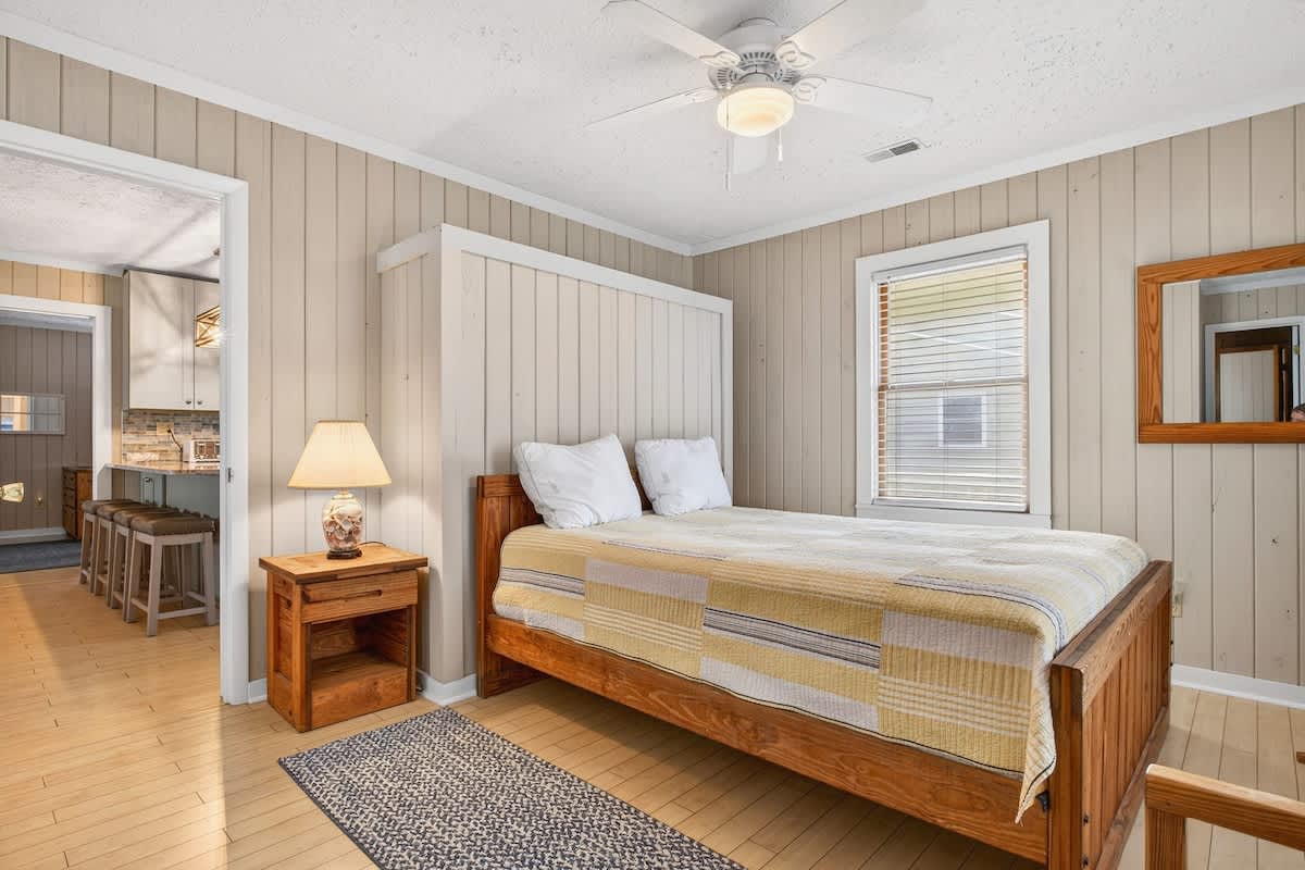 Queen bedroom with bright, welcoming design