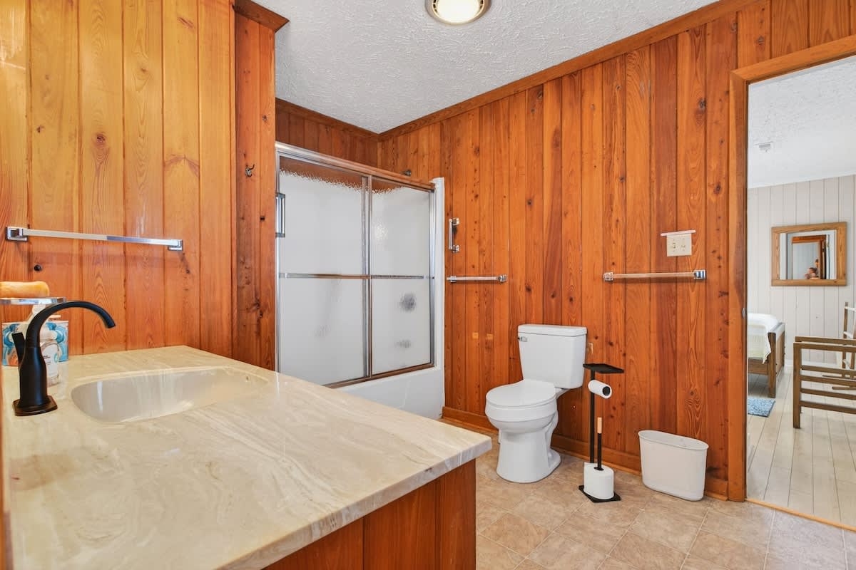 Large, thoughtfully designed bathroom with plenty of space