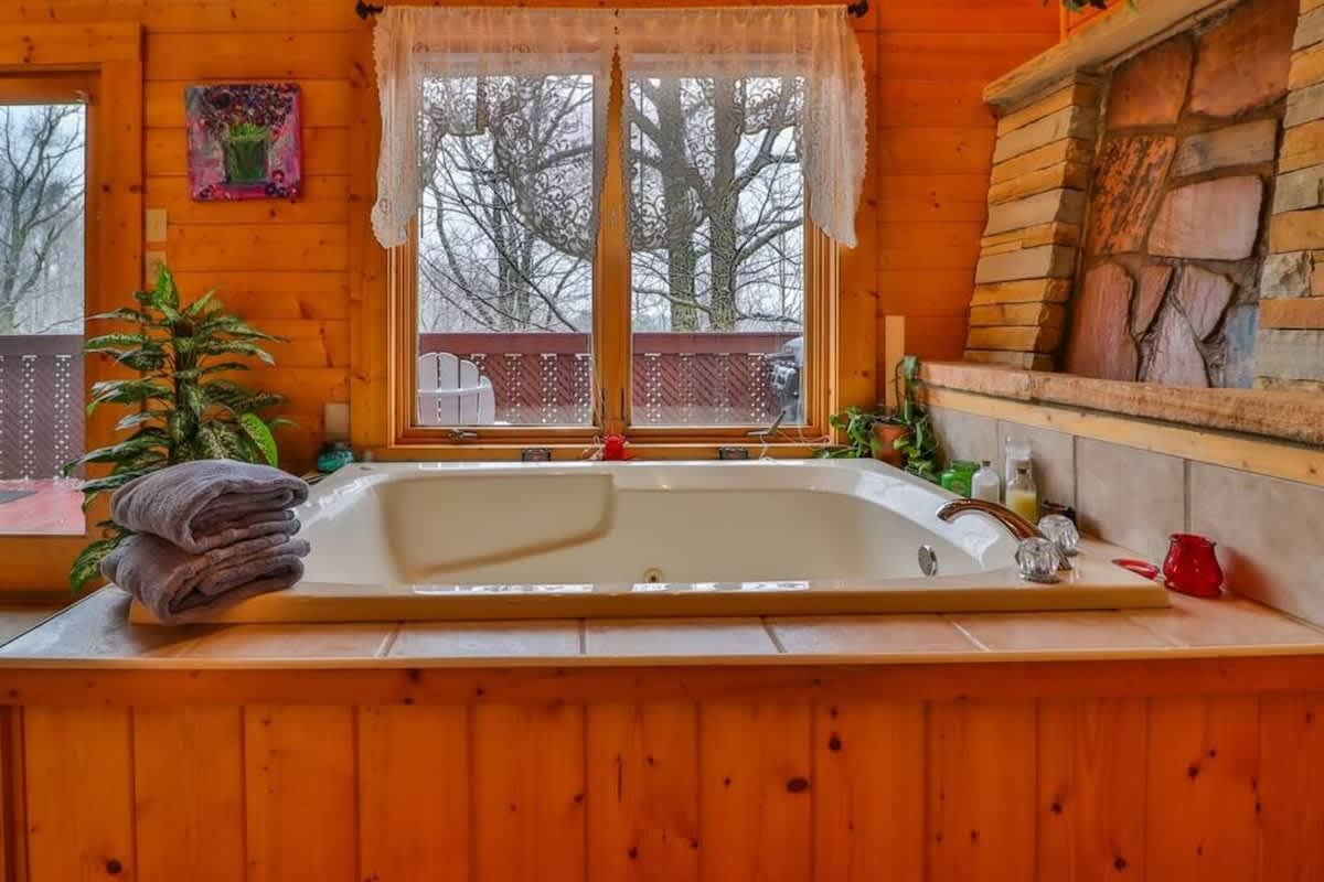 Unwind in the bubbling tub after a day of mountain adventures.