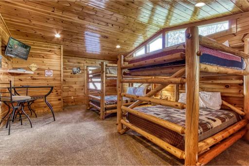 Bunk room with queen over queen bunk beds—ideal for kids or extra guests to spread out and relax
