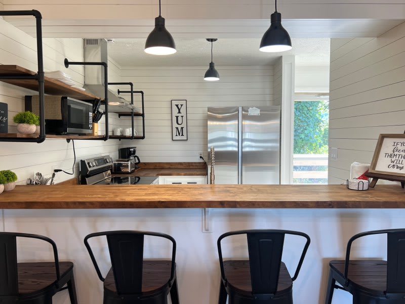 odern design with sleek appliances and an inviting bar for casual dining!