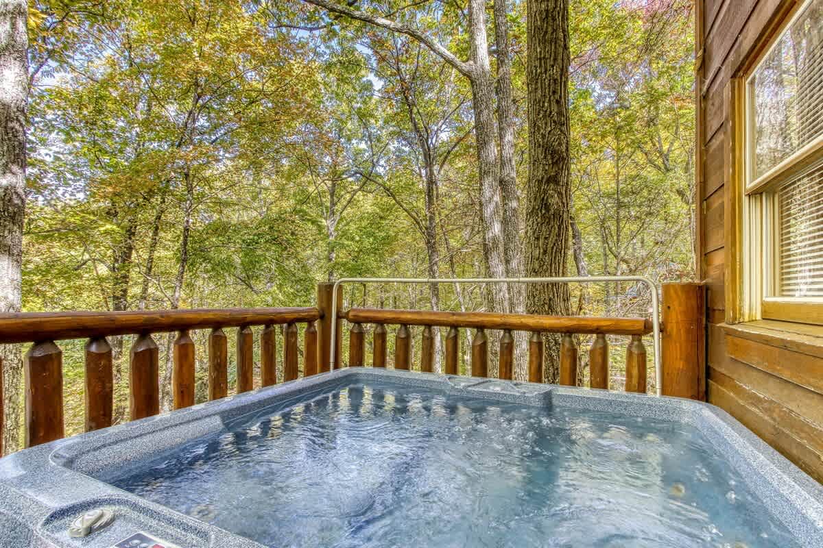 Relax in the bubbling spa surrounded by breathtaking forest views!