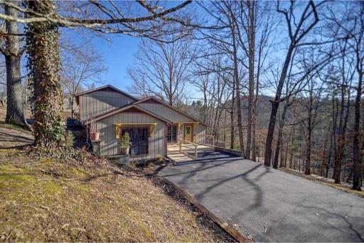 Exterior Retreat: Enjoy stunning mountain views and a spacious deck perfect for outdoor gatherings!