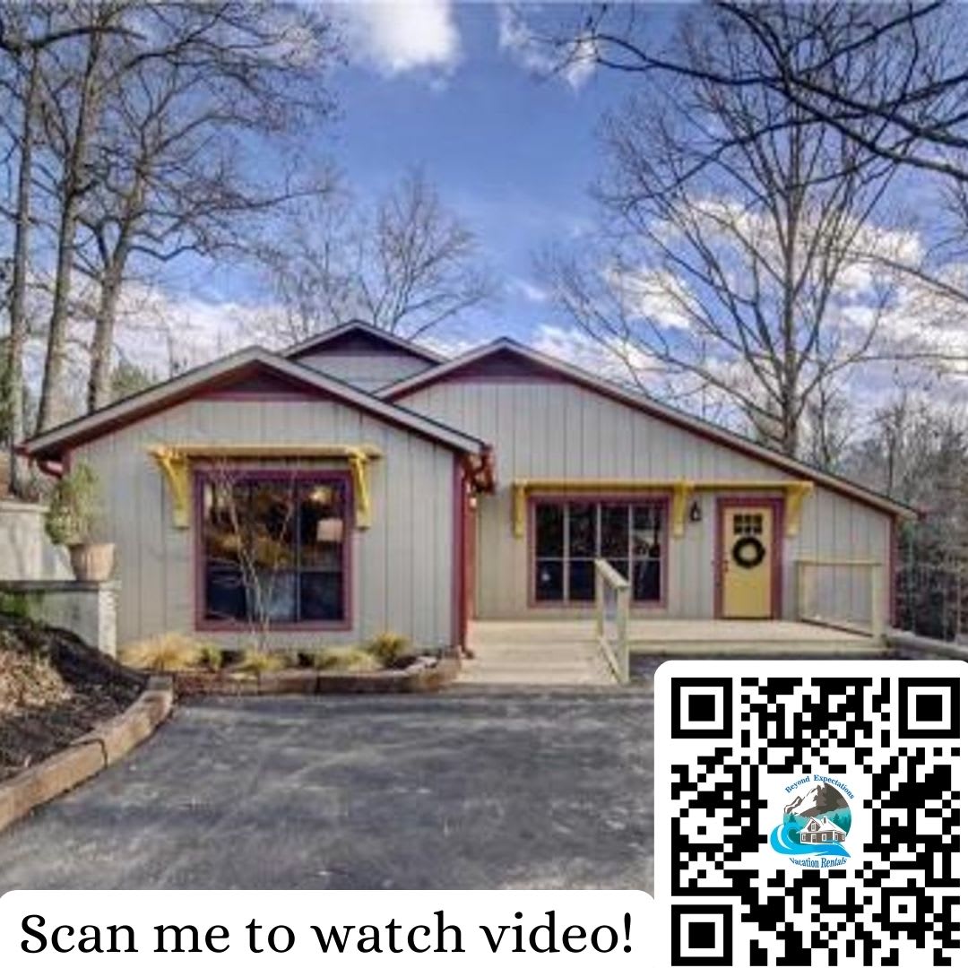 Charming Exterior: Step into your adventure with bright accents and forest views in Sevierville!