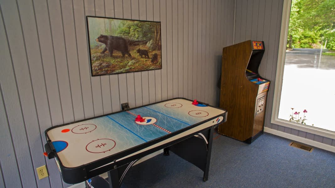 Community Recreation Room: Unleash your competitive spirit with air hockey and classic arcade fun!
