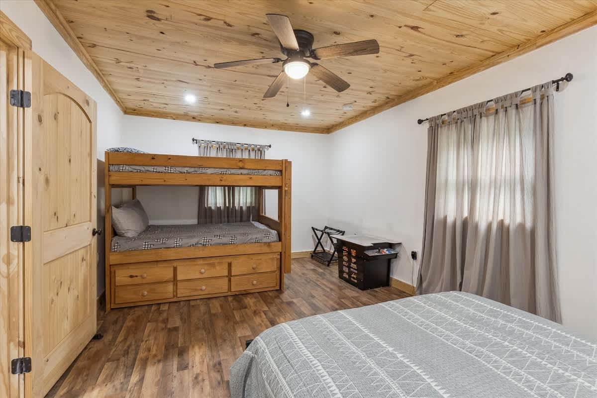 Bunk Space: Adventure awaits with a stylish bunk bed and rustic charm for family fun!