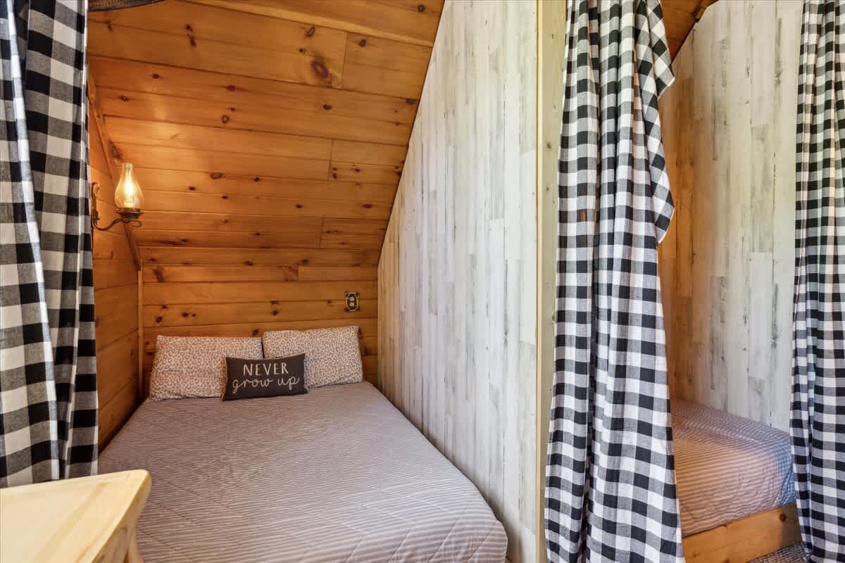 Charming Nook: Embrace adventure in this quaint space featuring warm wood and playful decor!