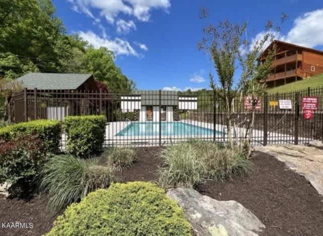 Splash into fun at the spacious seasonal pool surrounded by lush greenery and scenic views!