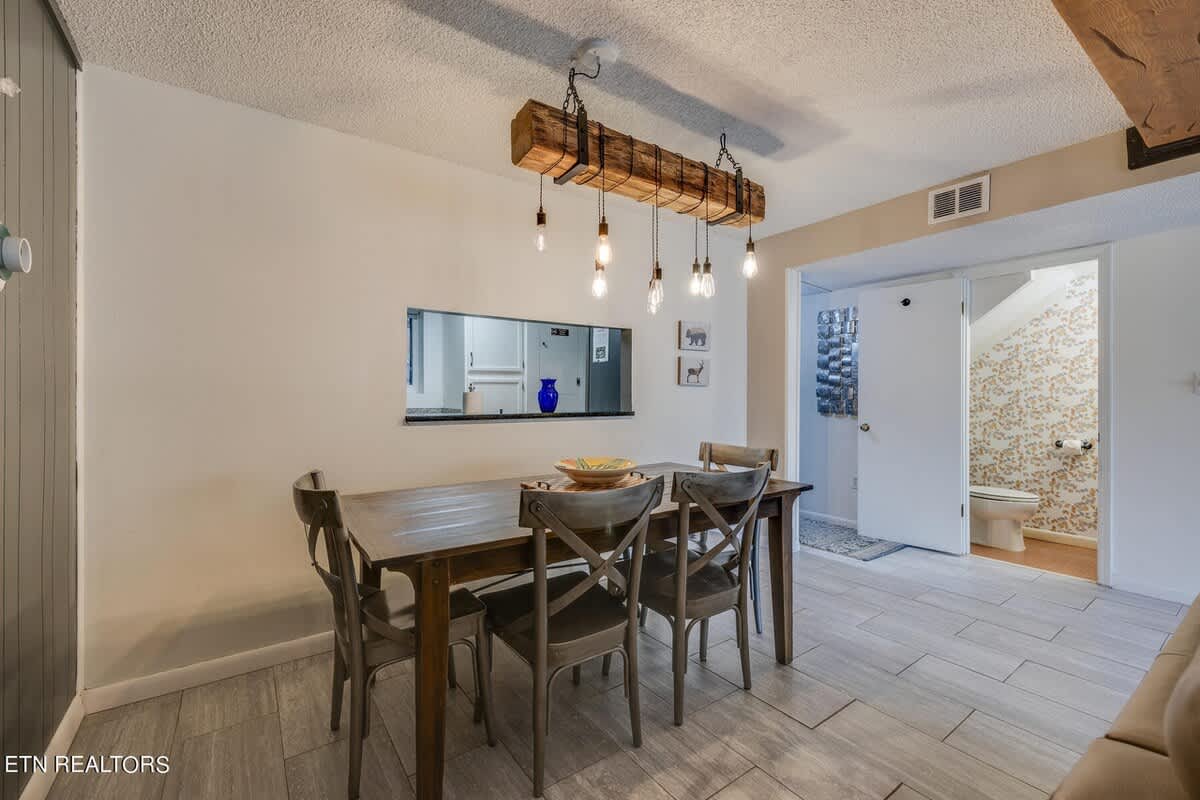 Dining Room: Rustic charm with a stylish table, perfect for family meals and game nights!
