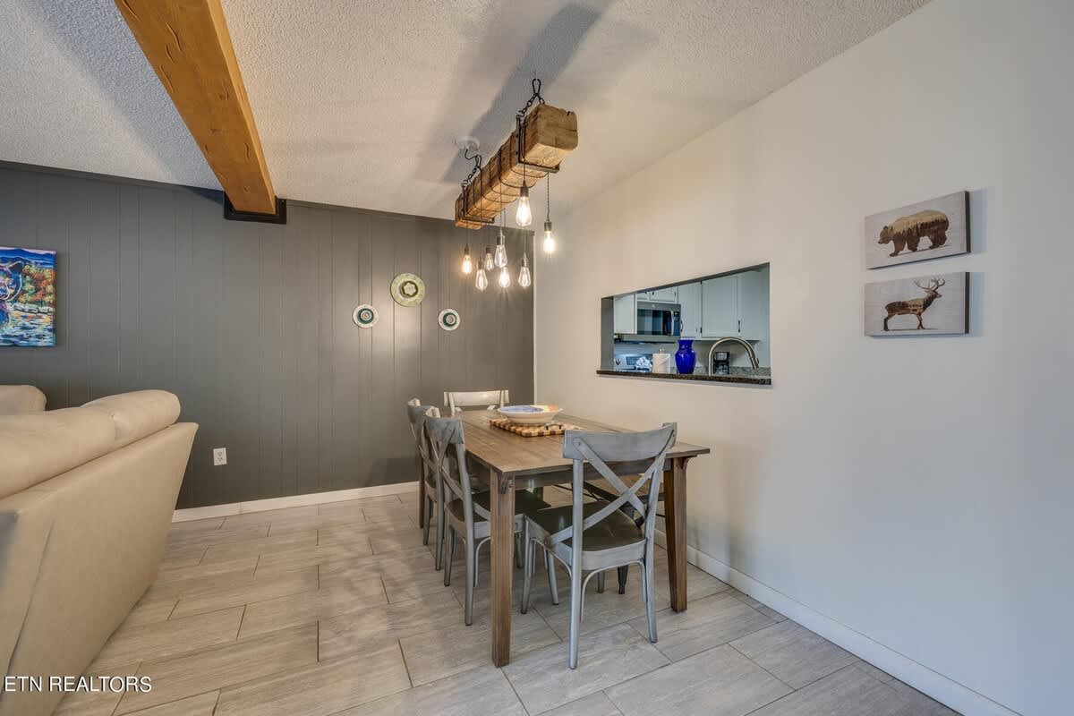 Dining Room: Gather around the rustic table under stylish pendant lights for unforgettable meals!