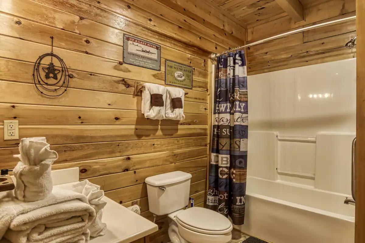 Bathroom Bliss: Rustic charm with wood accents and all amenities for a refreshing retreat!