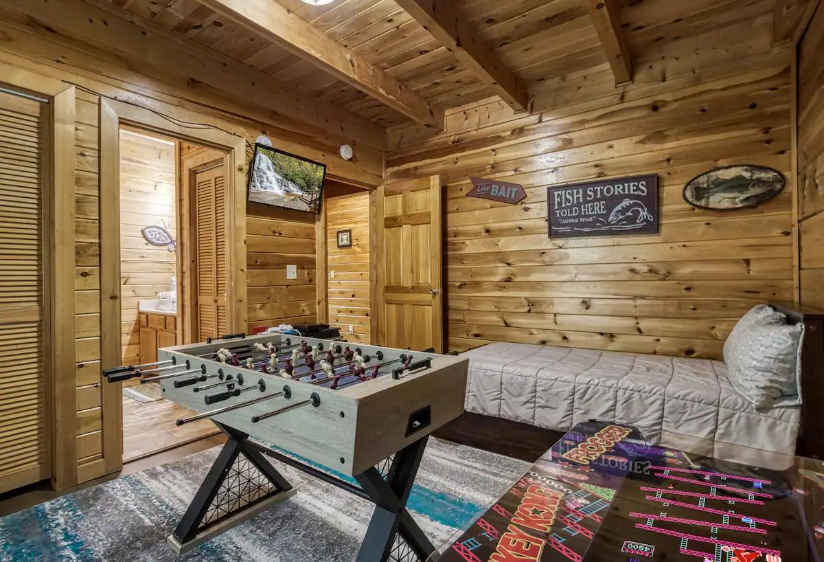  Challenge friends to foosball and unwind in a playful retreat surrounded by wood charm!