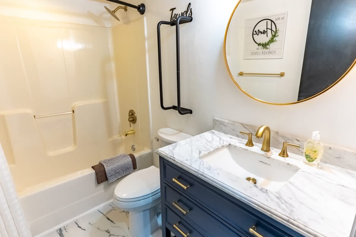 Bathroom Bliss: Elegant marble vanity and chic decor create a refreshing retreat!