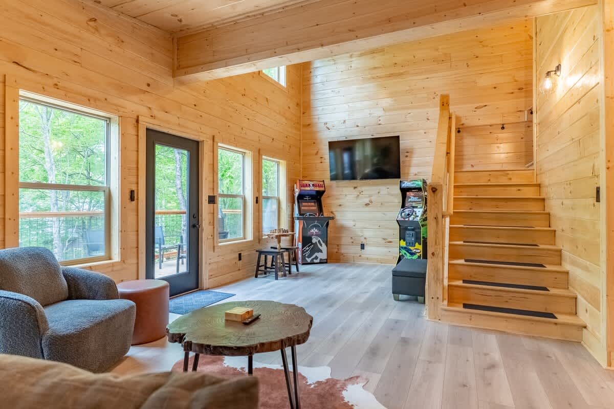 Bright space with wood accents, game corner, and stunning nature views!