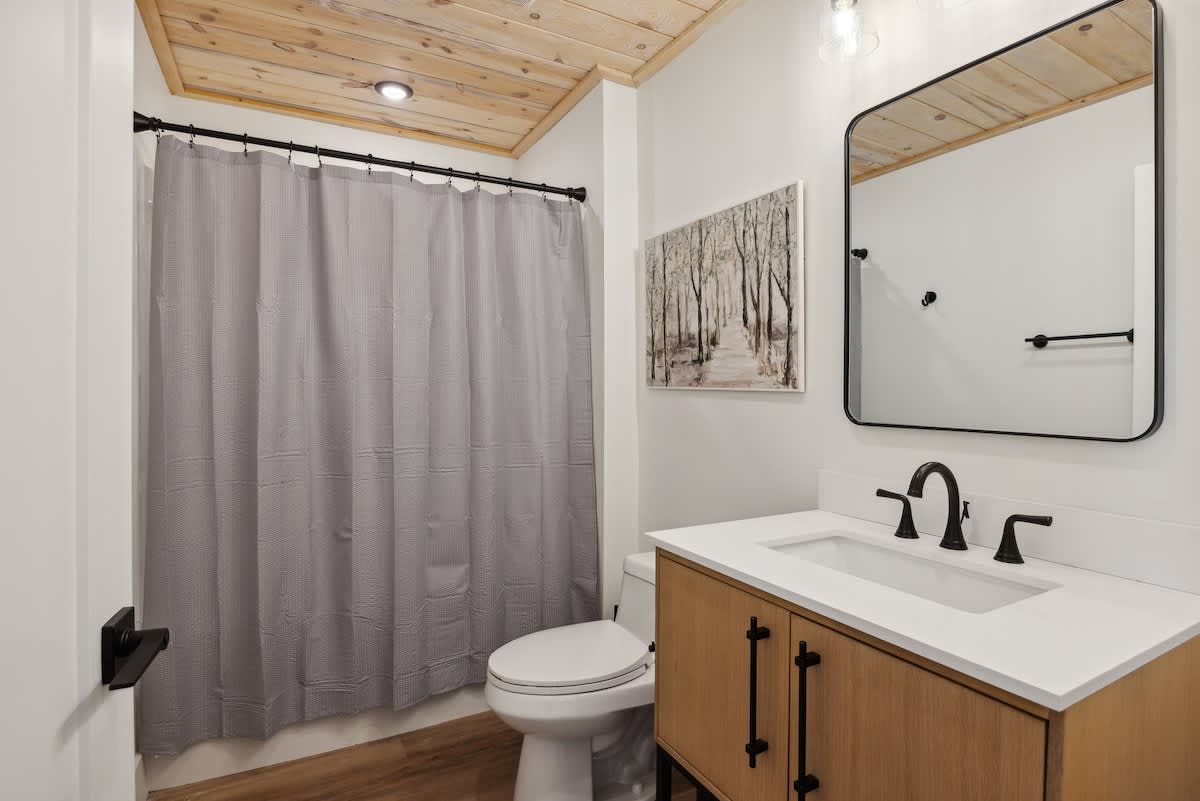 Modern finishes and charming art create a refreshing retreat for your getaway!