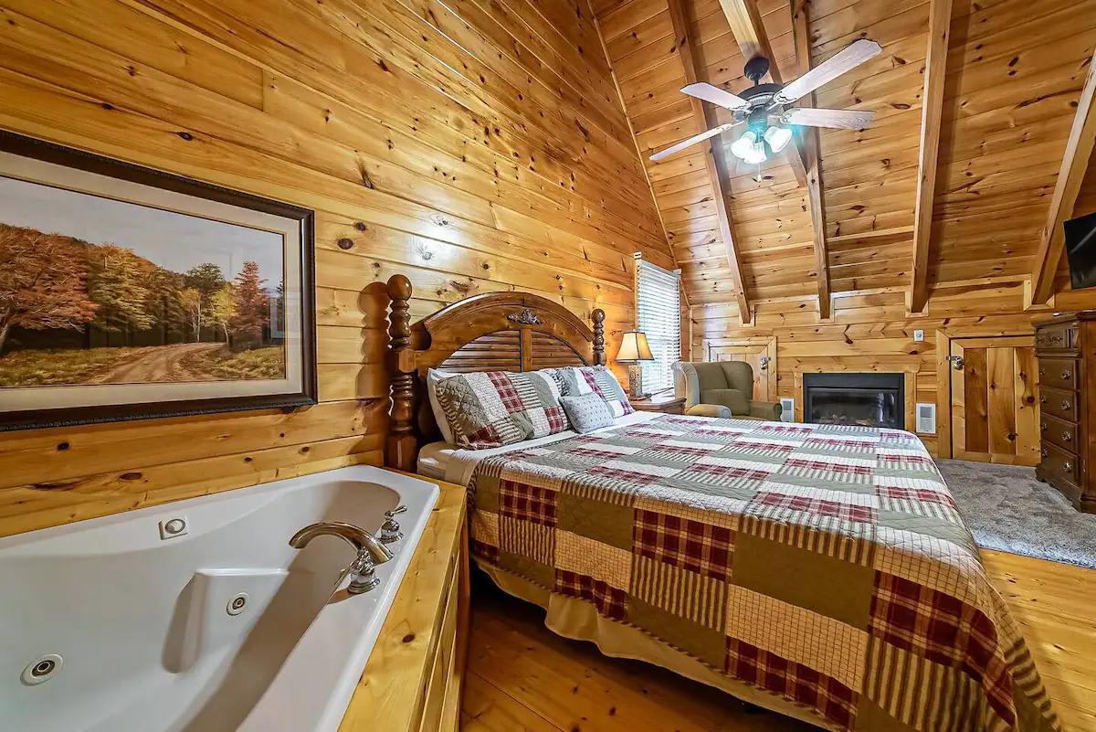 Primary Bedroom:  Experience warmth with wood accents, a fireplace, and a relaxing jetted tub!