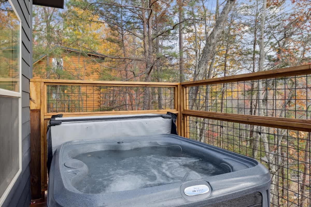 Hot Tub Oasis: Unwind in your private hot tub with stunning forest views and bubbling relaxation!