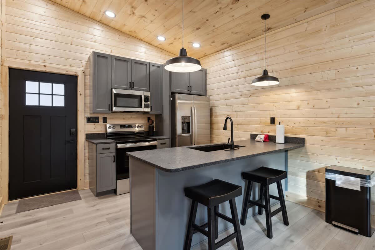 Kitchen: Bright and sleek space for culinary adventures with modern appliances and stylish seating!