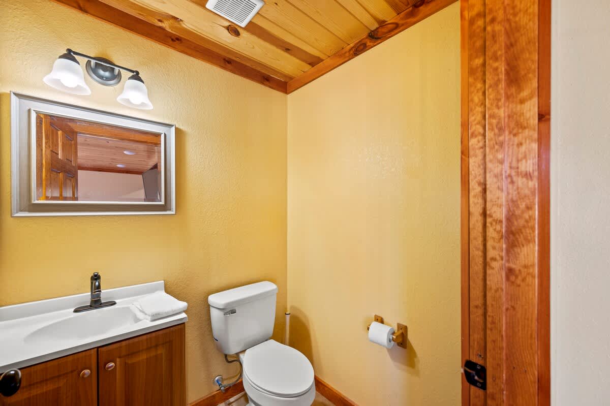 Bathroom Oasis: Bright, stylish retreat with modern fixtures and rustic charm awaits your refresh!