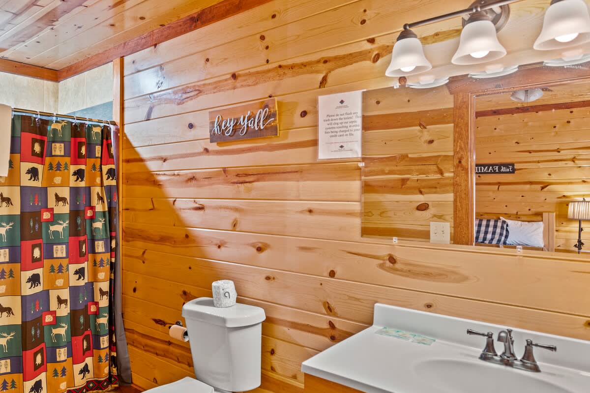 Bathroom Retreat: Rustic charm meets modern convenience with nature-inspired decor!