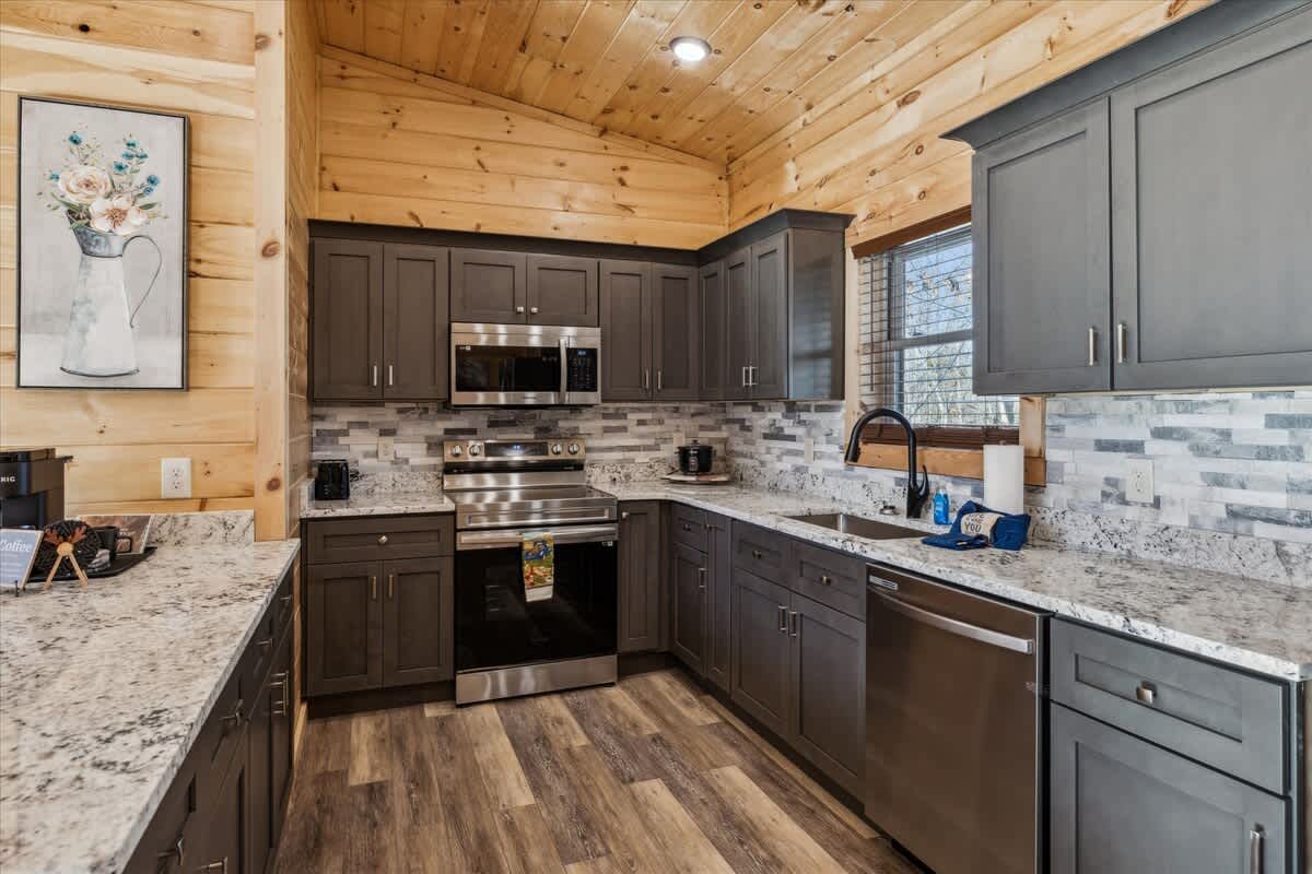 Kitchen: Sleek design meets high-end appliances for culinary adventures in the heart of nature!