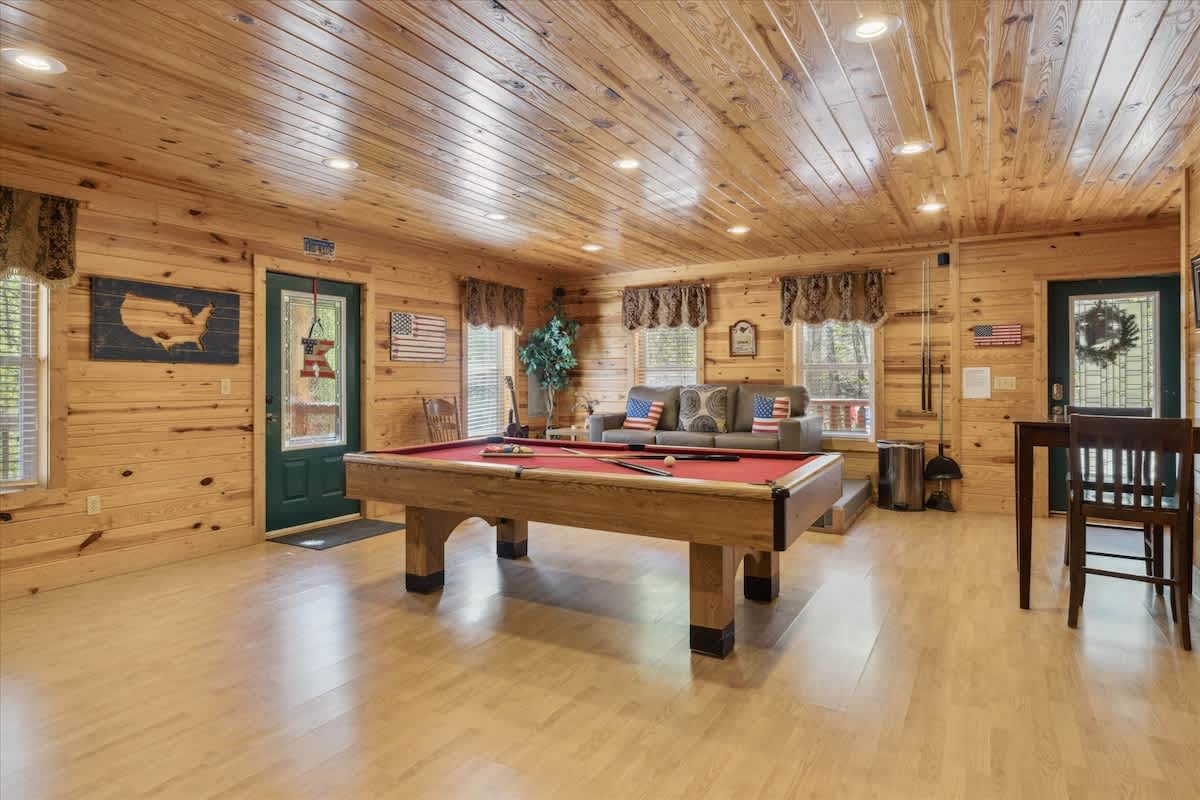 Game Room: Enjoy friendly competition at the billiards table in this stylish, wood-paneled retreat!
