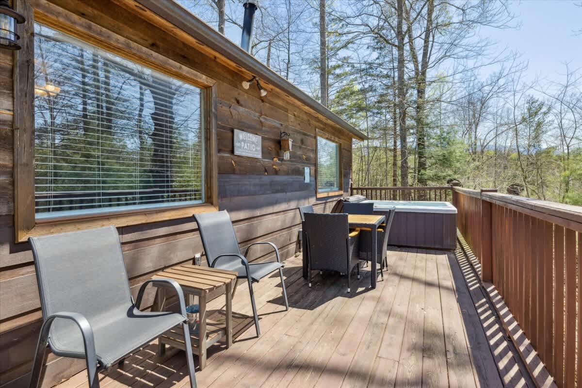Unwind in nature with a private hot tub and dining set on your retreat from the ordinary!