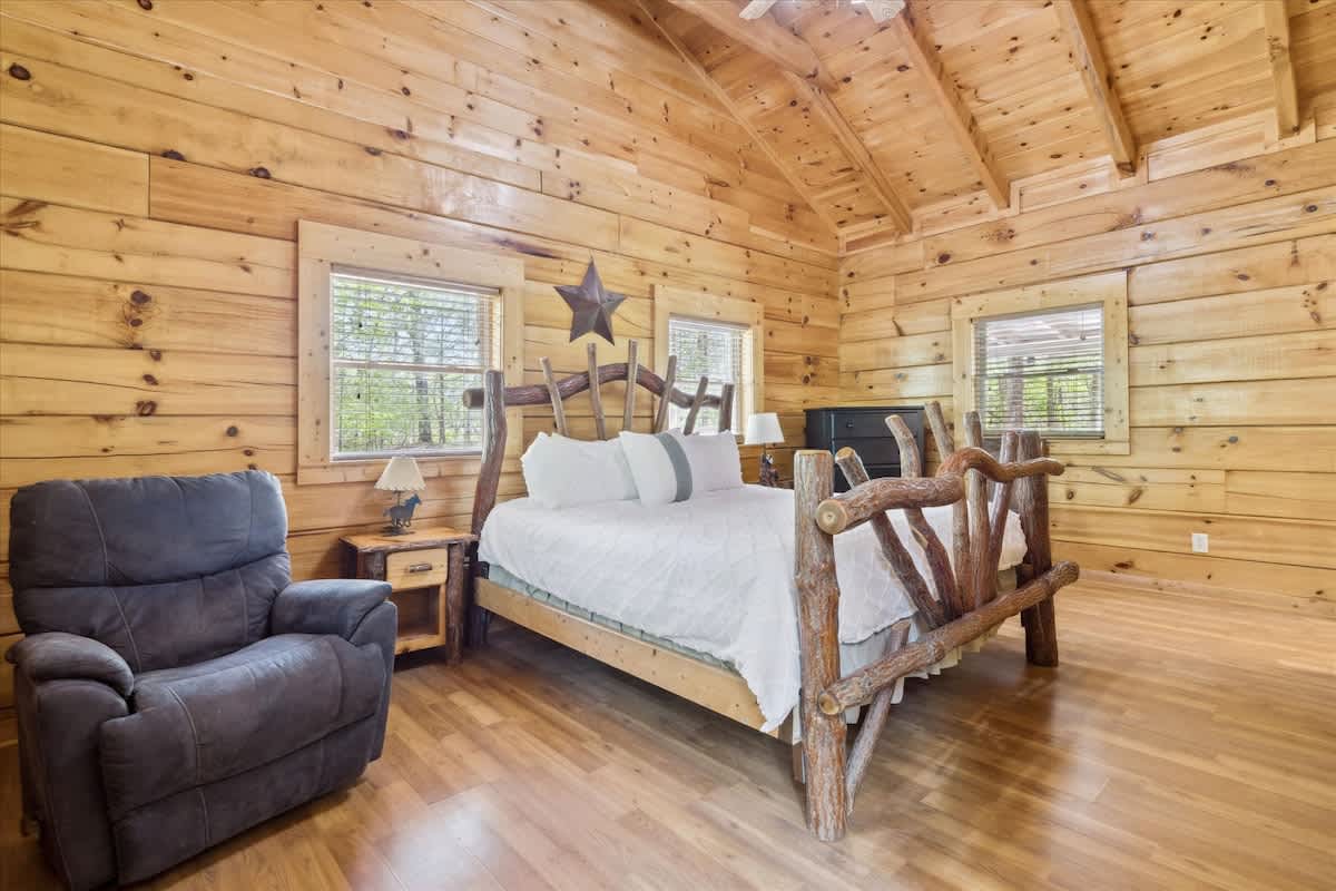  Embrace nature with rustic charm, featuring a plush bed and tranquil forest views!