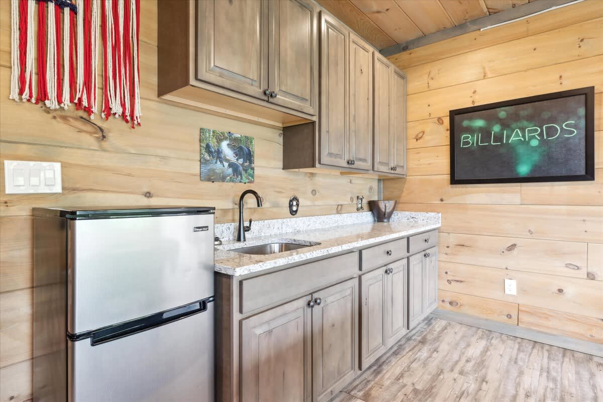 Game Room: Enjoy spirited fun with billiards and a stylish kitchenette at your retreat!