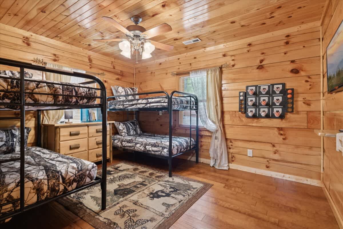 Bunk Room: Adventure awaits in this rustic retreat with fun bunk beds and playful decor!