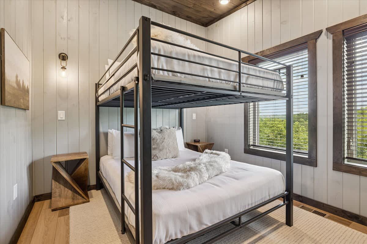 The double over double bunk has cozy bedding. 