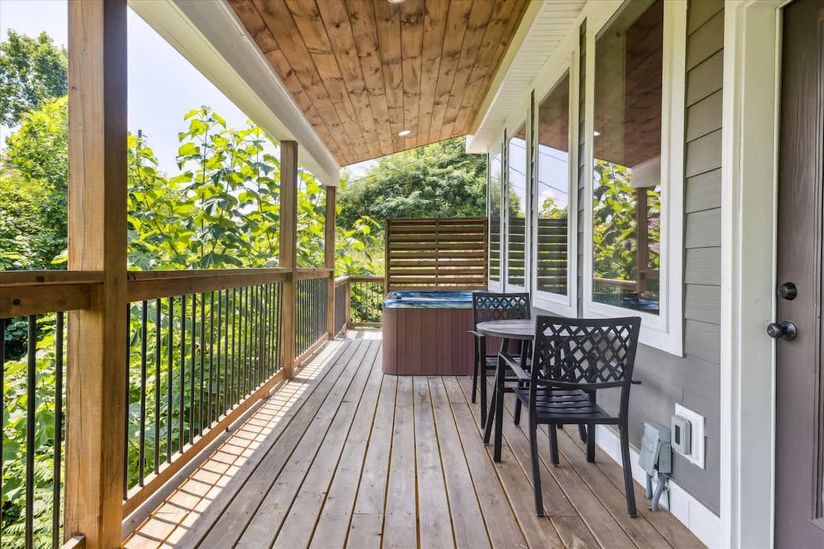 Relax in the hot tub with lush views in this inviting outdoor retreat!