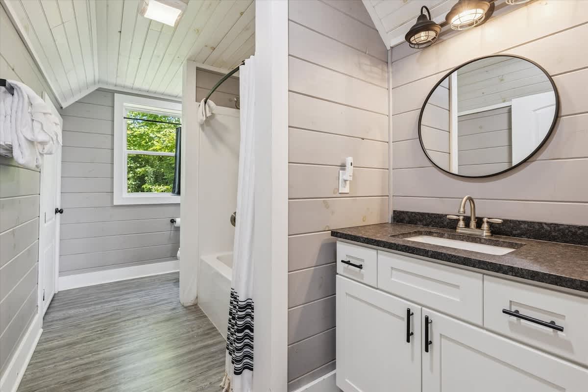 Bathroom Oasis: Modern fixtures and natural light for your refreshing retreat in Gatlinburg!